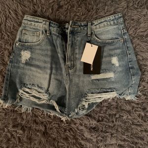 ripped light wash jeans shorts